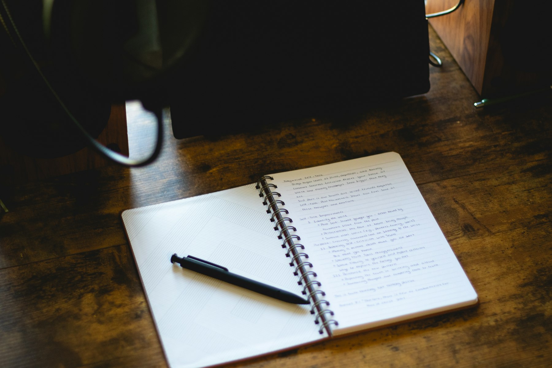 Open notebook and pen representing business planning, ideas and strategy.
